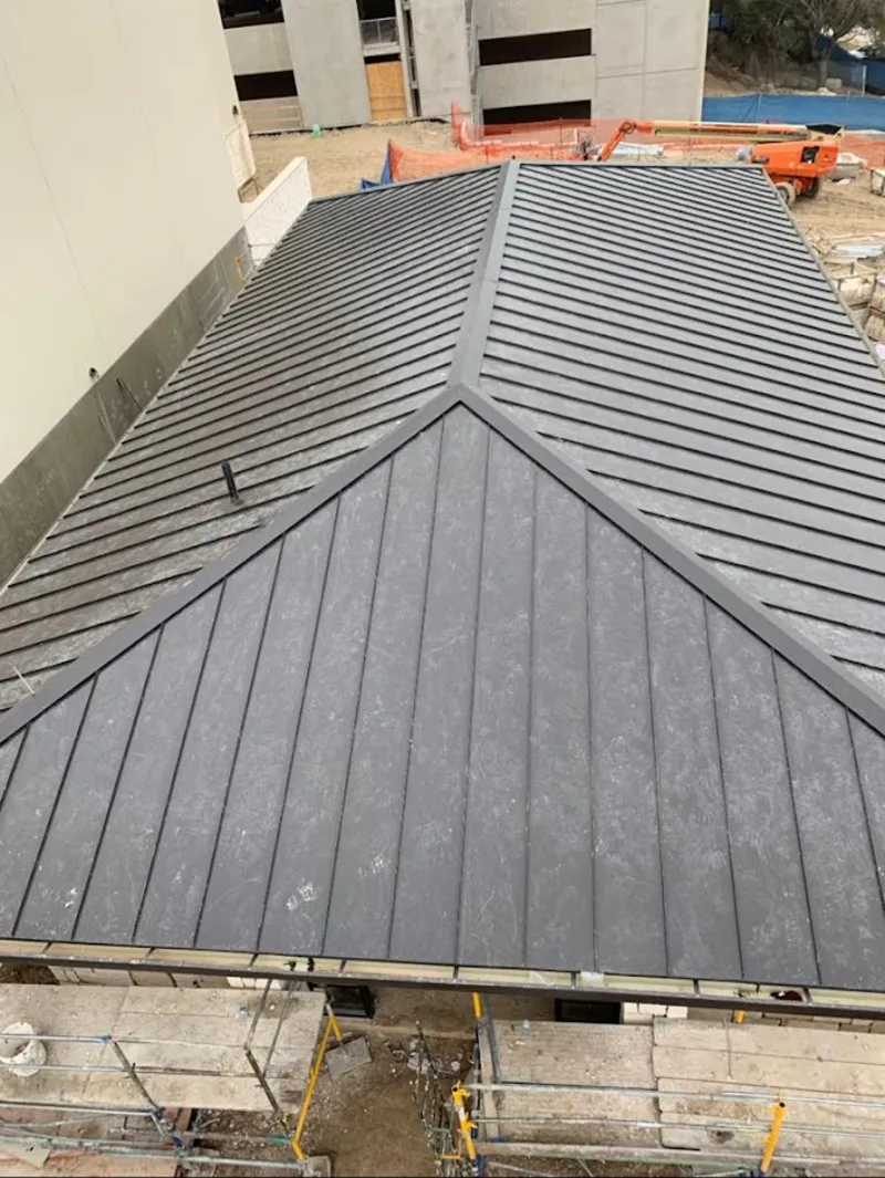 Commercial metal roof construction with crane equipment in Greenbrier